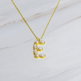 Gold chain necklace featuring an elegant initial pendant inlaid with pearl mosaic accents for a personalized, sophisticated touch.