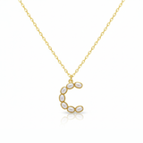 Gold necklaces with pearl-like beads on a initial pendant C with white background