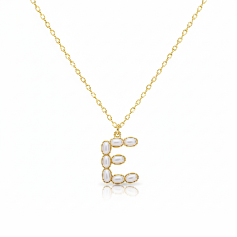 Gold necklaces with pearl-like beads on a initial pendant E with white background