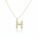 Gold necklaces with pearl-like beads on a initial pendant H with white background