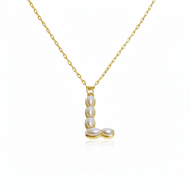 Gold necklaces with pearl beads on a initial pendant L with white background
