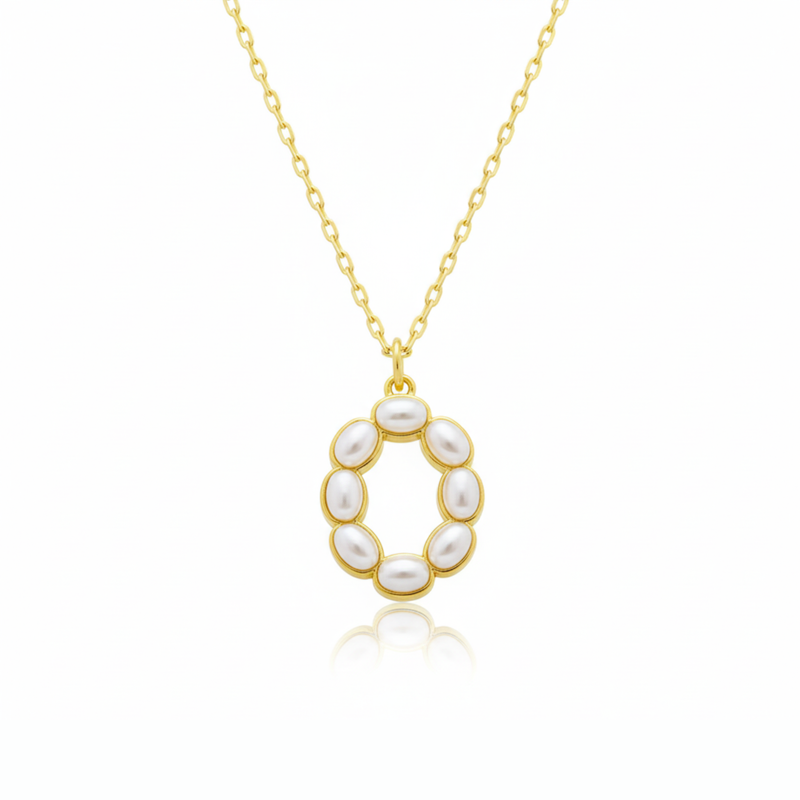Gold necklaces with pearl beads on a initial pendant O with white background