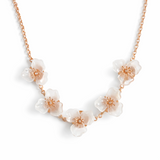 Necklace with floral pendants on a white background