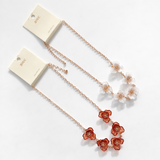Floral necklace with rose gold chain on a white background