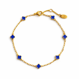 Delicate gold bracelet featuring a petite clover charm on a single fine chain. The minimalist design adds a touch of everyday elegance with its subtle shine and timeless silhouette, perfect for layering or wearing solo.