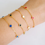 Delicate gold bracelet featuring a petite clover charm on a single fine chain. The minimalist design adds a touch of everyday elegance with its subtle shine and timeless silhouette, perfect for layering or wearing solo.