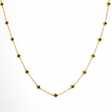 Gold-toned necklace featuring a delicate colored clover pendant, suspended on a fine chain for a soft pop of charm and color.