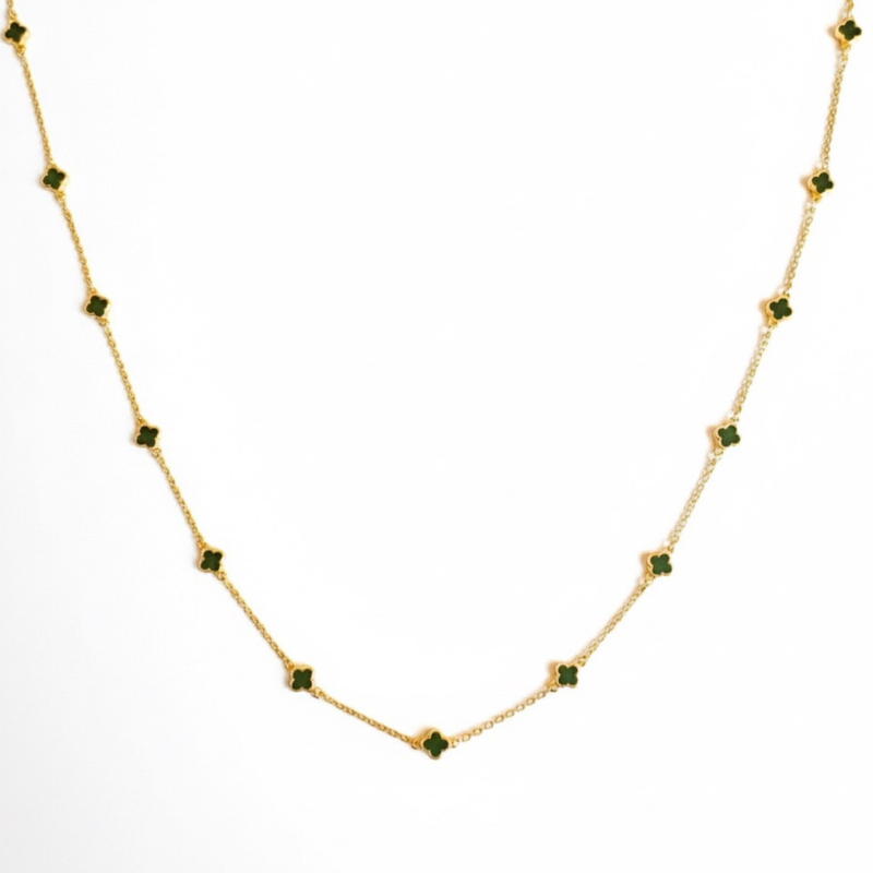 Gold-toned necklace featuring a delicate colored clover pendant, suspended on a fine chain for a soft pop of charm and color.