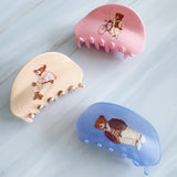 Preppy-inspired bear hair claw clips featuring fashionable teddy bear dressed in vintage collegiate outfits. Each clip showcases a different bear character on a pastel background, adding a playful yet polished touch to any hairstyle.