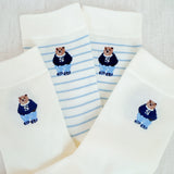 Set of cozy crew socks featuring charming preppy bear illustration in classic outfits, adding a playful and nostalgic touch to everyday wear.