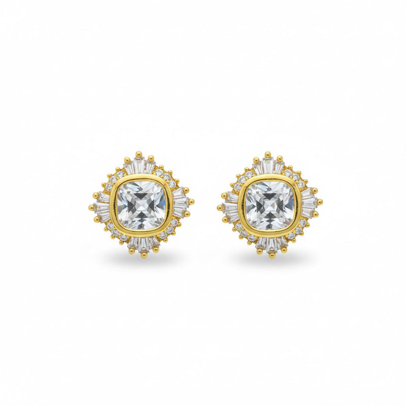 Gold-tone stud earrings featuring a radiant crown-like cluster of sparkling stones, arranged in a semi-circle to create a regal yet minimal look.