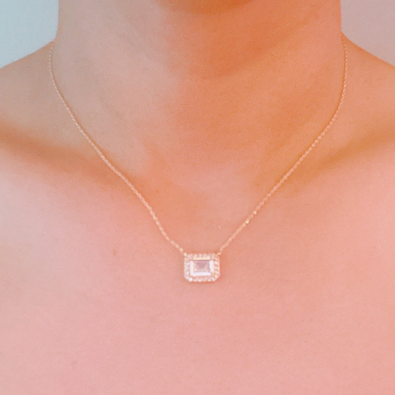 Dainty chain necklace featuring a radiant emerald-cut pendant in a classic prong setting, offering timeless elegance with a subtle touch of sparkle.