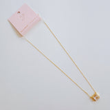 Dainty chain necklace featuring a radiant emerald-cut pendant in a classic prong setting, offering timeless elegance with a subtle touch of sparkle.