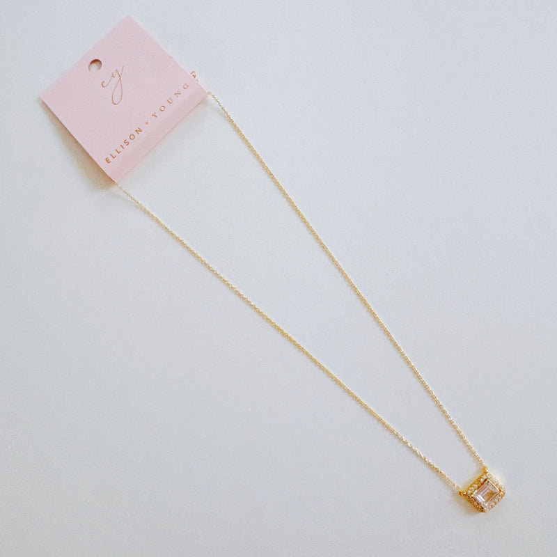 Dainty chain necklace featuring a radiant emerald-cut pendant in a classic prong setting, offering timeless elegance with a subtle touch of sparkle.