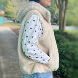 Real-Feel-Faux-Mink-Vest-Hooded-And-Effortless-Beige-Mink-On-Person_Side-Look