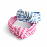 Textured fabric twist knot headband with a structured silhouette and soft-touch finish, designed to elevate both everyday and dressed-up outfits with a polished, stylish look.