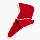 A red knit baby bootie with a white scalloped trim, folded on a clean white background.