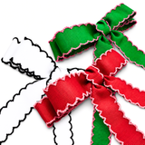 Green and red ribbons with pink edges on a white background