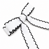Black and white ribbon bow on a white background