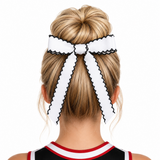 White headband with black trim worn by a person with blonde hair on a white background