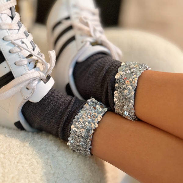 Sparkly socks featuring a sequin-embellished top band, adding a touch of chic shine and glam to any outfit.
