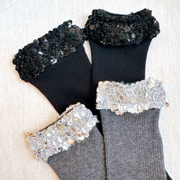 Sparkly socks featuring a sequin-embellished top band, adding a touch of chic shine and glam to any outfit.
