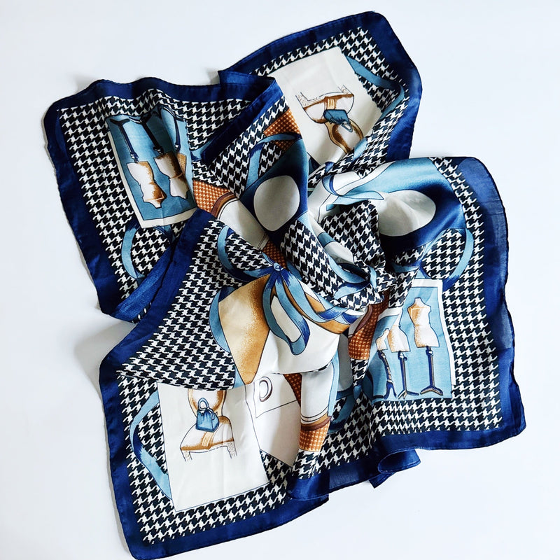 Elegant satin square scarf with a smooth, glossy finish—perfect for versatile styling as a hair accessory, neck tie, or bag accent.