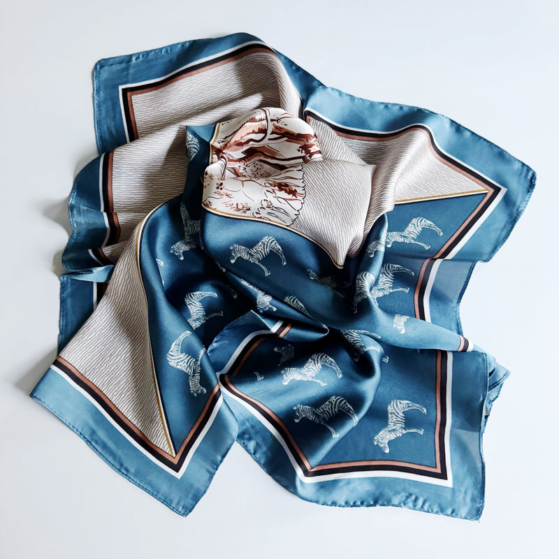 Elegant satin square scarf with a smooth, glossy finish—perfect for versatile styling as a hair accessory, neck tie, or bag accent.