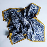 Elegant satin square scarf with a smooth, glossy finish—perfect for versatile styling as a hair accessory, neck tie, or bag accent.