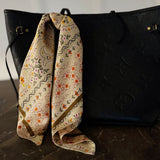 Elegant satin square scarf with a smooth, glossy finish—perfect for versatile styling as a hair accessory, neck tie, or bag accent.