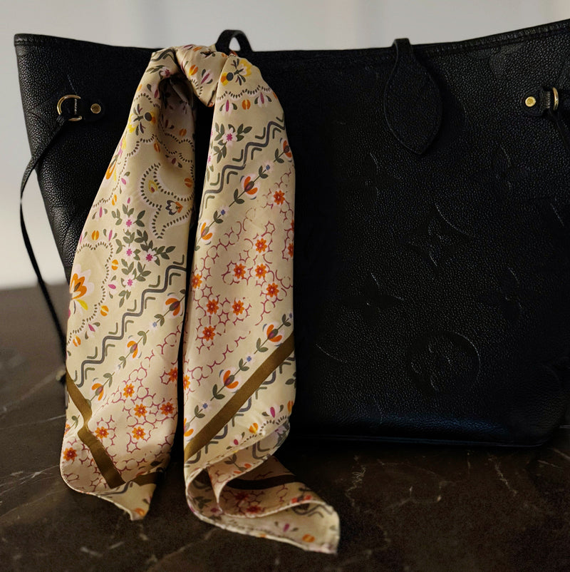 Elegant satin square scarf with a smooth, glossy finish—perfect for versatile styling as a hair accessory, neck tie, or bag accent.