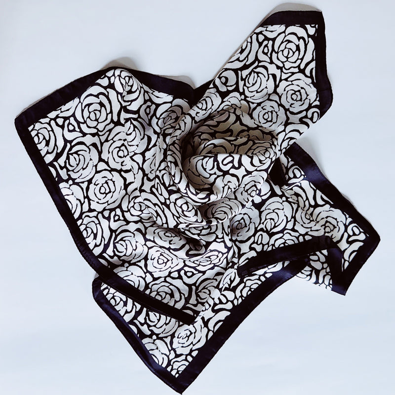 Elegant satin square scarf with a smooth, glossy finish—perfect for versatile styling as a hair accessory, neck tie, or bag accent.