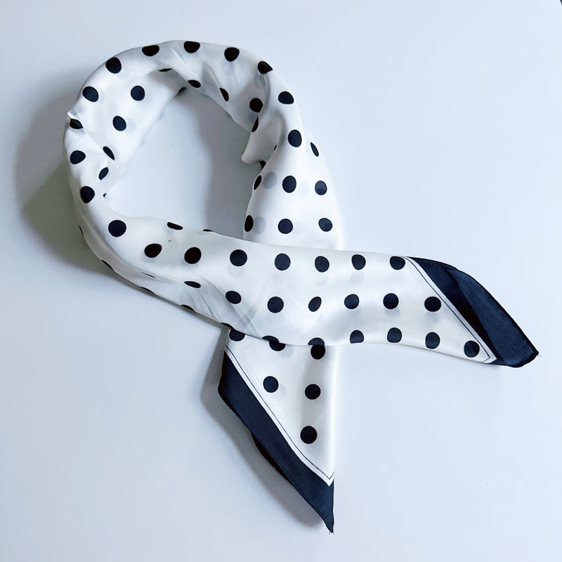 Elegant satin square scarf with a smooth, glossy finish—perfect for versatile styling as a hair accessory, neck tie, or bag accent.