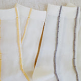 Set of two minimalist crew socks featuring subtle contrast stitching at the top and toe, adding a clean and stylish detail to everyday wear.