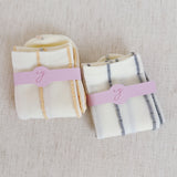 Set of two minimalist crew socks featuring subtle contrast stitching at the top and toe, adding a clean and stylish detail to everyday wear.