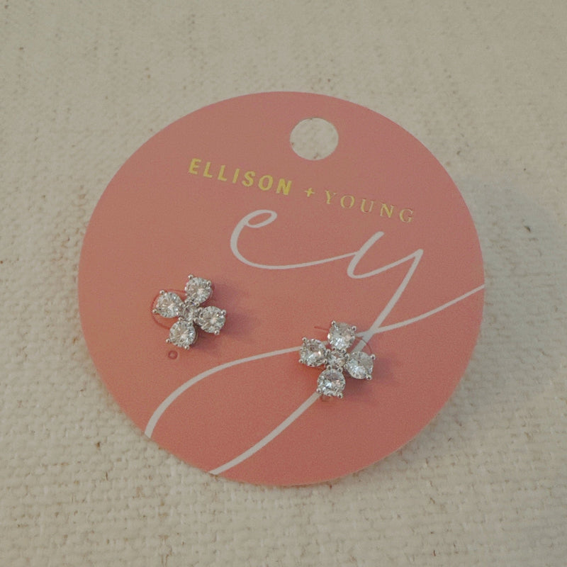 Silver-tone stud earrings in a floral clover shape, each featuring four pear-shaped cubic zirconia stones arranged in a symmetrical pattern for a radiant and delicate sparkle.