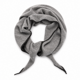A light gray knit scarf with black trim along the edges, styled in a loose loop on a plain white background.