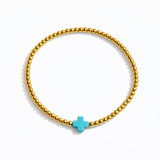 Beaded gold bracelet featuring a small polished cross charm centered. The So Very Blessed Cross Bracelet offers a meaningful, minimalist design perfect for everyday wear or gifting.