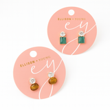 Chic stud earrings featuring a combination of a shimmering stone and polished natural stone accent. These earrings blend refined sparkle with modern design, perfect for elevating both casual and dressy looks.