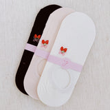 Set of three low cut socks featuring playful strawberry-themed patterns in soft pastel tones, designed for comfort and everyday charm.