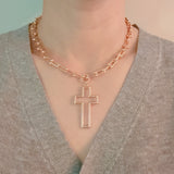 Stylish-Cross-Pendant-U-Chain-Necklace-In-Gold-On-Person