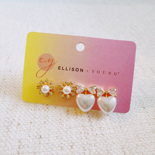 Set of two pearl earrings featuring playful sunny-side-up egg and classic pearl designs, combining whimsy with elegance.
