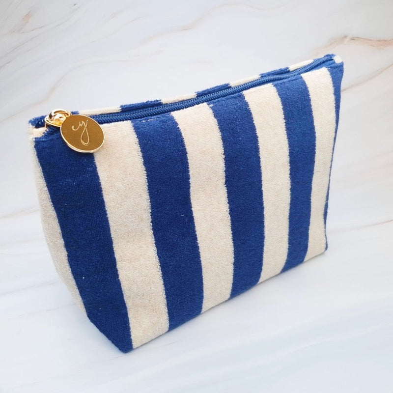 Versatile cosmetic pouch made from soft terry fabric with colorful striped detailing—perfect for storing makeup, toiletries, or everyday essentials on the go.