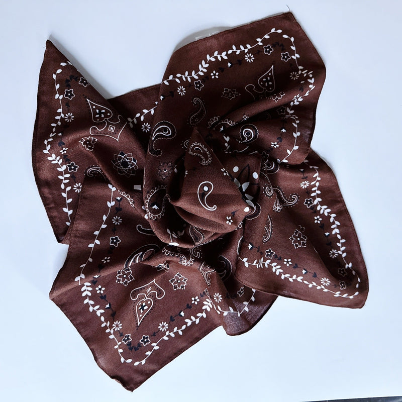 Lightweight textured square scarf with a soft finish, ideal for accessorizing hair, necklines, or handbags with effortless elegance.