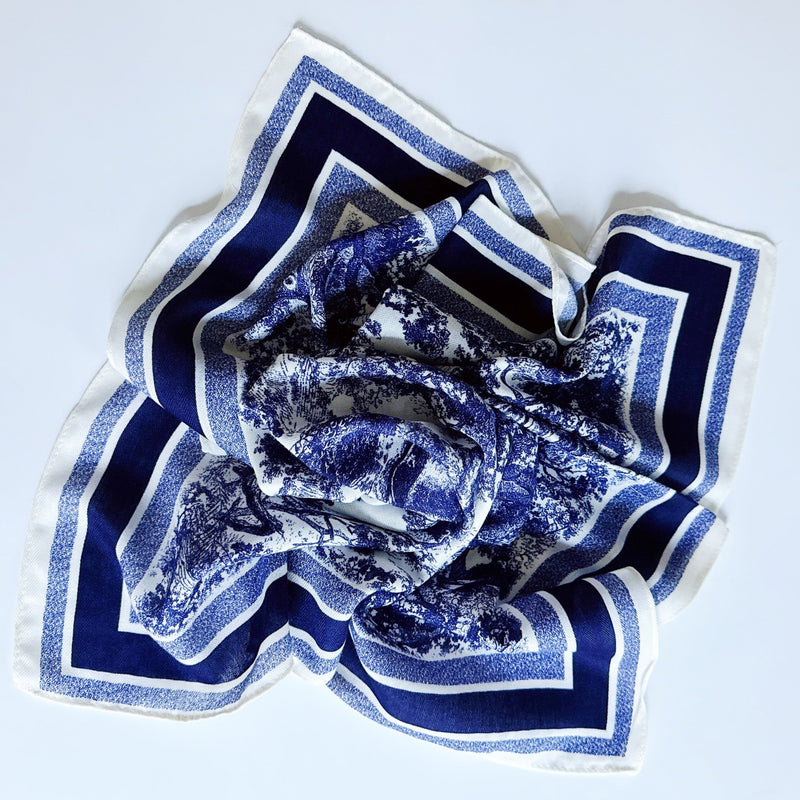 Lightweight textured square scarf with a soft finish, ideal for accessorizing hair, necklines, or handbags with effortless elegance.