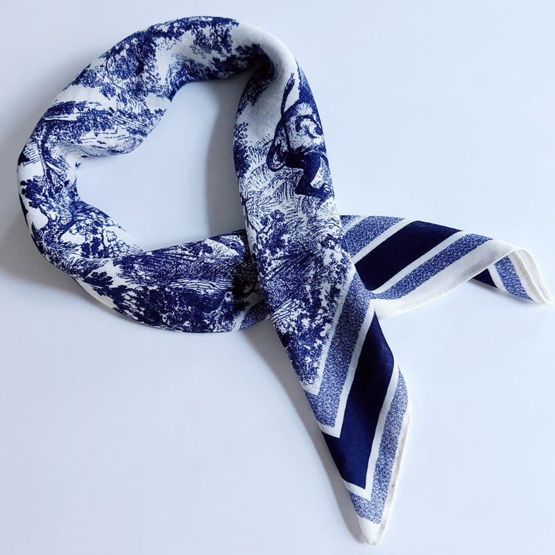 Lightweight textured square scarf with a soft finish, ideal for accessorizing hair, necklines, or handbags with effortless elegance.