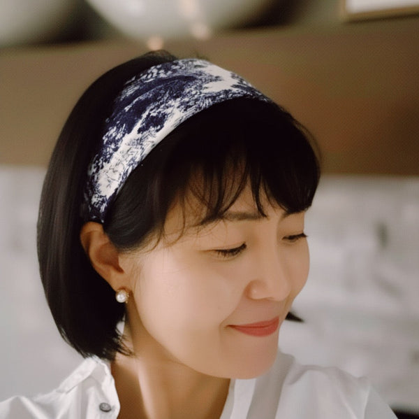 Lightweight textured square scarf with a soft finish, ideal for accessorizing hair, necklines, or handbags with effortless elegance.