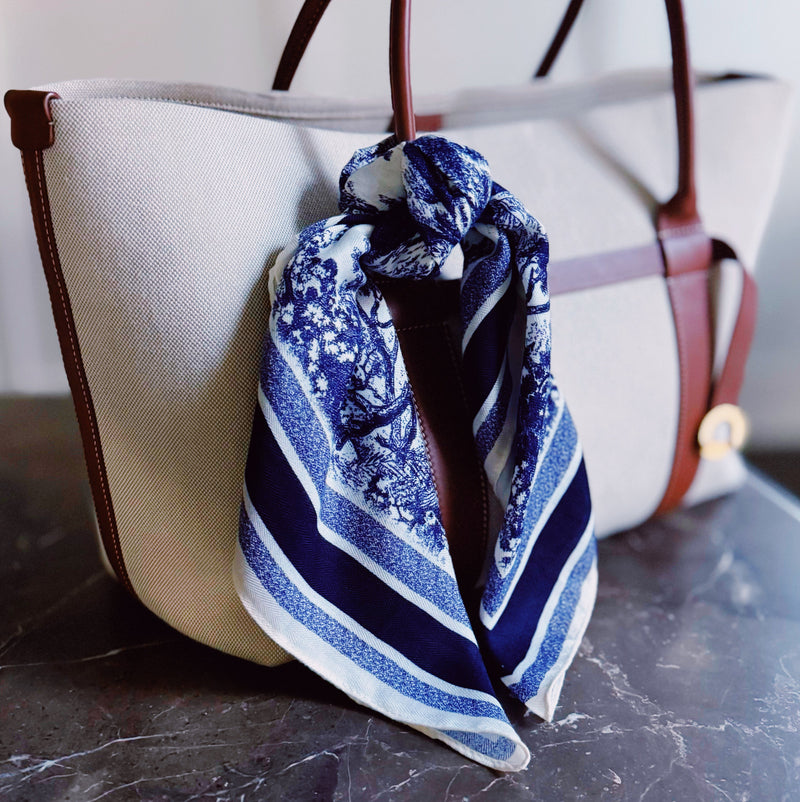 Lightweight textured square scarf with a soft finish, ideal for accessorizing hair, necklines, or handbags with effortless elegance.