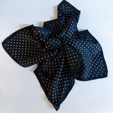 Lightweight textured square scarf with a soft finish, ideal for accessorizing hair, necklines, or handbags with effortless elegance.