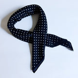 Lightweight textured square scarf with a soft finish, ideal for accessorizing hair, necklines, or handbags with effortless elegance.